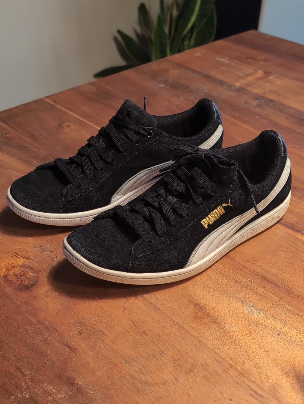 Puma Women’s Black Suede Sneakers with White Stripe and Gold Logo